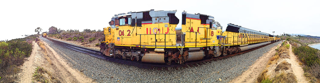 Panoramic Train coming around the bend printed on natural pine wood.